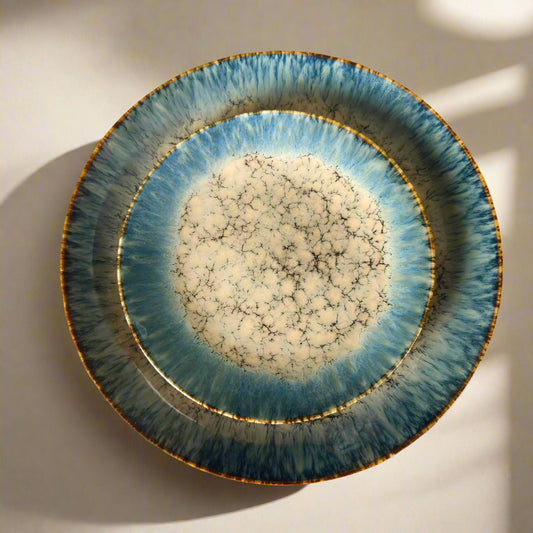 Decorative ceramic plate with a unique texture on a patterned background