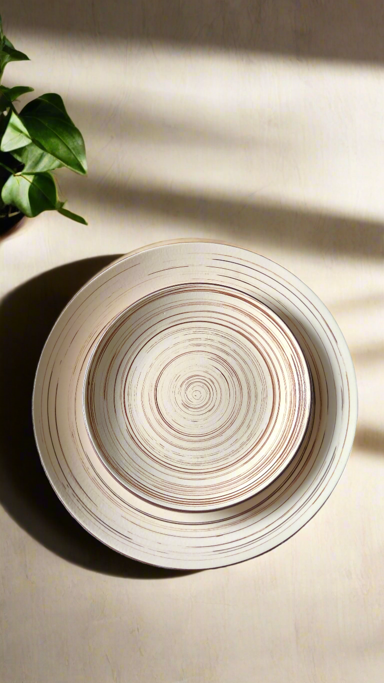 Ceramic plate with concentric circle design on a beige surface