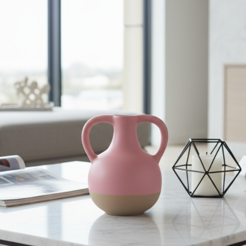 Pink ceramic vase with a beige base on a gray background