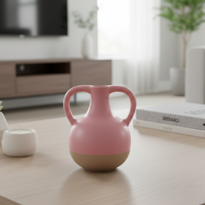 Pink ceramic vase with a beige base on a gray background